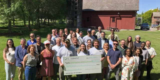 Working Lands Event - image of program officials and grantees with large check