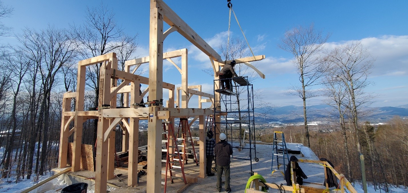 House being built out of timber frames in winter