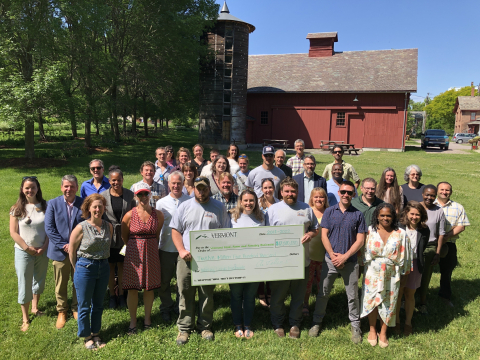 Working Lands Event - image of program officials and grantees with large check